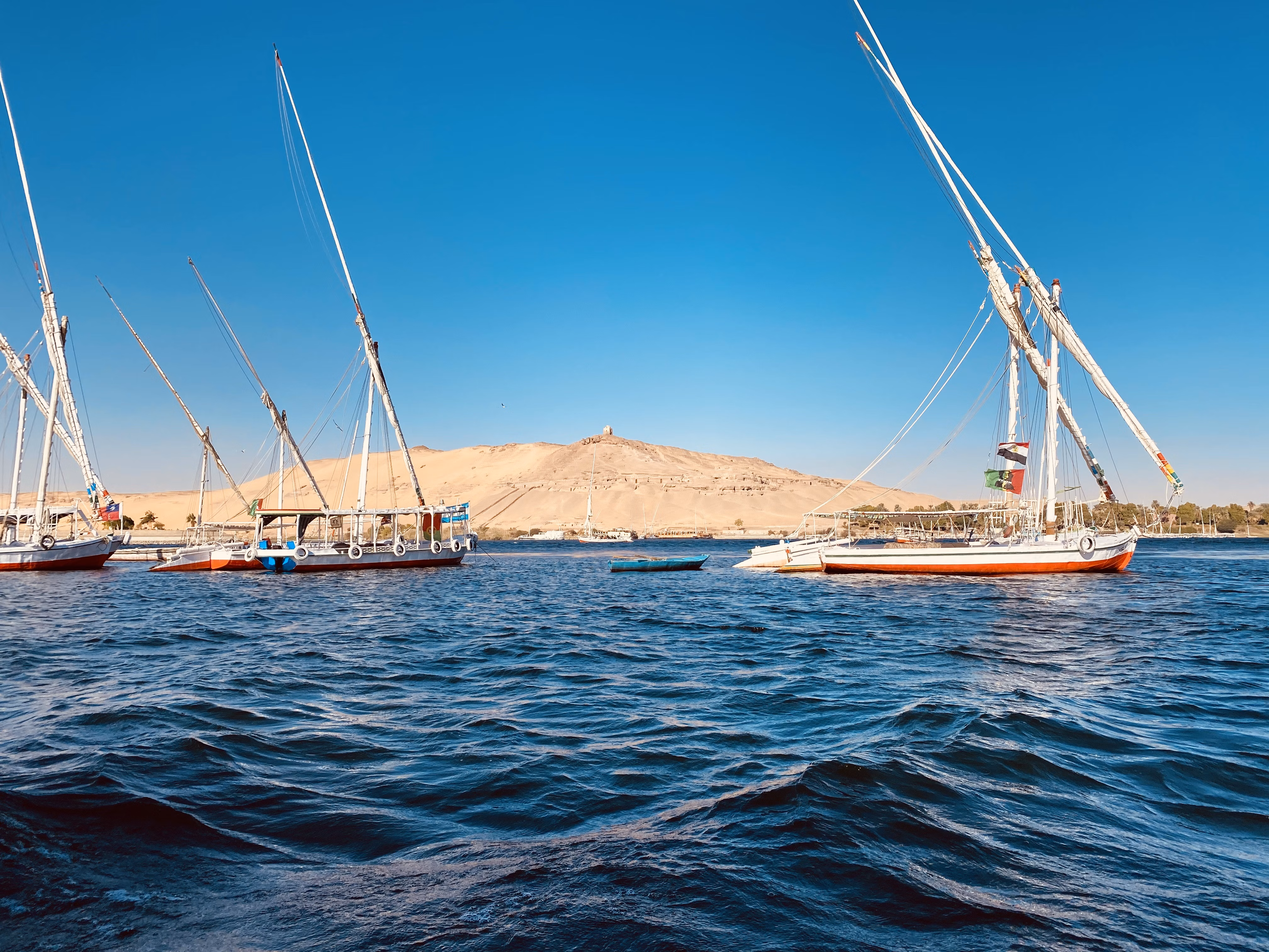 White and red boat on Nile River